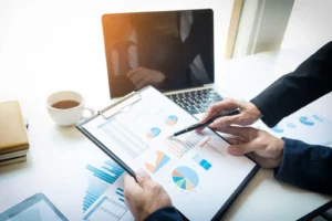 HR analyst reviewing performance charts on a tablet